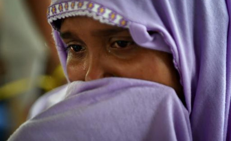 Langsa (Indonésie) (AFP). Scènes de carnage à bord d'un bateau de migrants au large de l'Indonésie