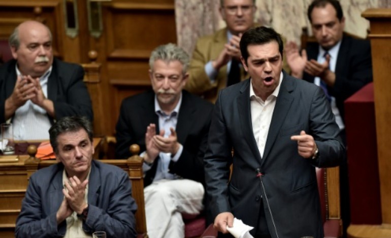 Athènes (AFP). Grèce: Tsipras fait adopter de premières exigences des créanciers, grâce à l'opposition