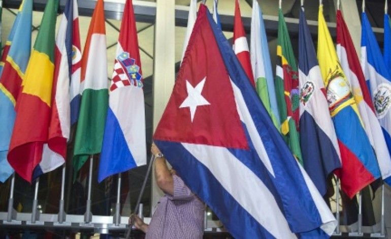 Washington (Etats-Unis) (AFP). Reprise des relations diplomatiques: le drapeau cubain hissé à Washington