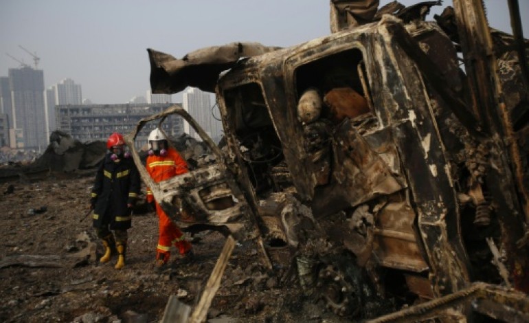 Tianjin (Chine) (AFP). Explosions à Tianjin: plus de 100 morts, évacuation de quartiers résidentiels