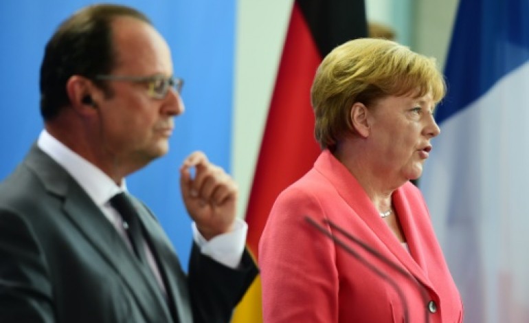 Berlin (AFP). Migrants: Merkel et Hollande pour une réponse unifiée de l'UE