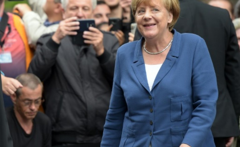 Berlin (AFP). Crise migratoire: Merkel se rend dans un foyer de réfugiés