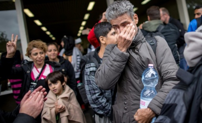 Munich (Allemagne) (AFP). L'Allemagne accueille un nombre record de migrants, Vienne en appelle à l'UE 