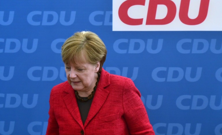 Berlin (AFP). Merkel maintient le cap sur les réfugiés malgré une déroute électorale