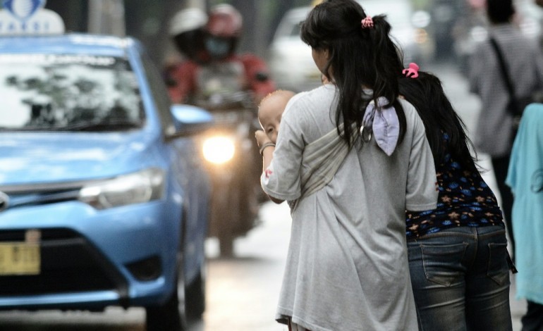 Jakarta (AFP). Jakarta: dans les coulisses du covoiturage obligatoire, des enfants exploités et drogués