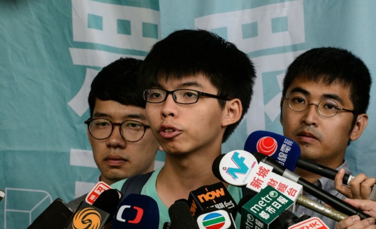 Hong Kong (AFP). Hong Kong: trois figures de la "révolte des parapluies" échappent à la prison