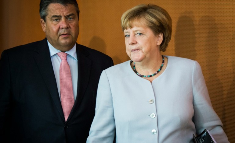 Berlin (AFP). Allemagne: un an après l'ouverture aux réfugiés, Merkel face à une flambée populiste 