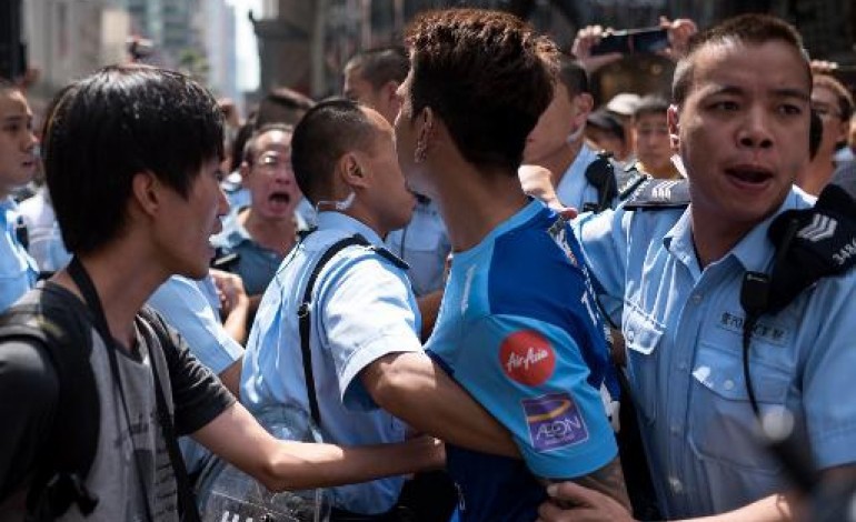 Hong Kong (AFP). Hong Kong: 20 blessés lors de nouveaux heurts 
