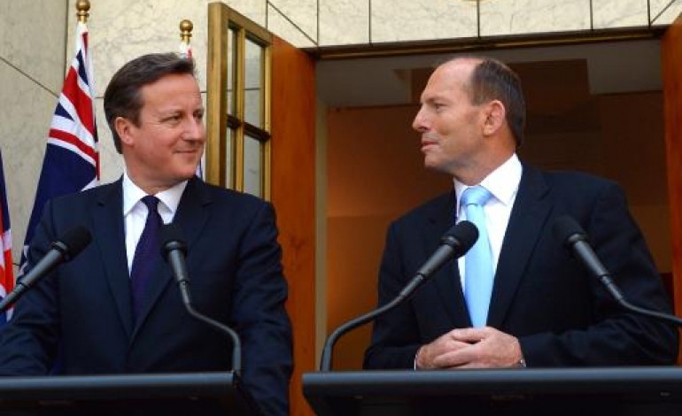 Canberra (AFP). Cameron et Abbott disent à Poutine de cesser de se comporter en agresseur