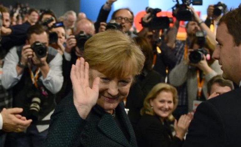 Cologne (Allemagne) (AFP). Merkel réélue triomphalement à la tête de la CDU