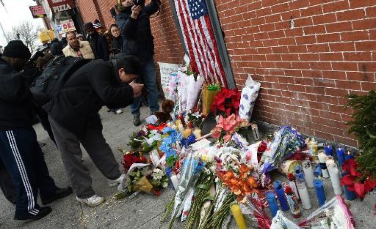 New York (AFP). New York sous le choc après l'assassinat de deux policiers