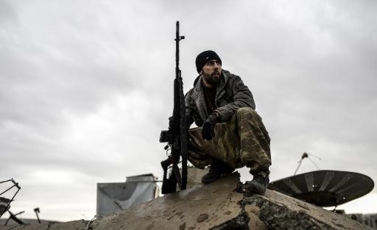 Kobané (Syrie) (AFP). Syrie: cerné de cadavres dans Kobané, un sniper kurde expose ses exploits