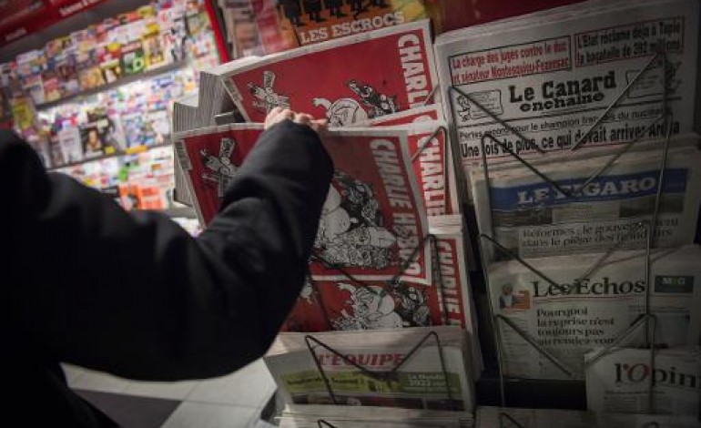 Paris (AFP). Charlie Hebdo de retour dans les kiosques se vend doucement