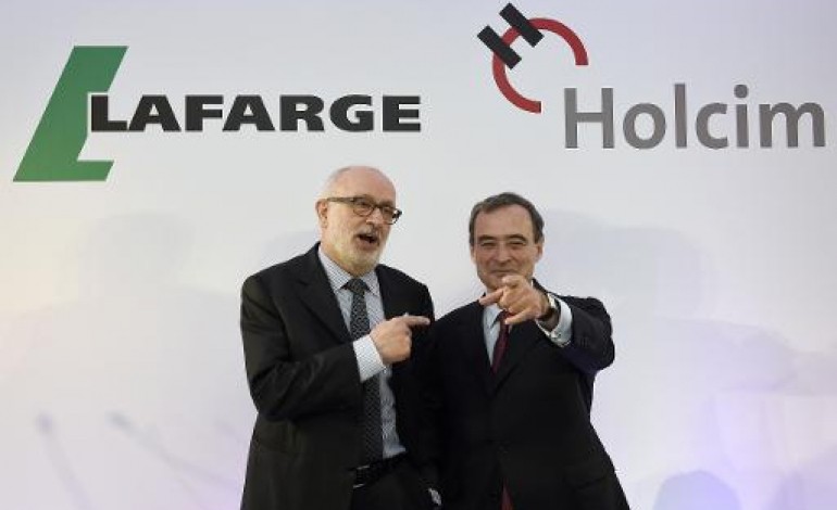 Paris (AFP). Lafarge et Holcim sauvent leur fusion, Bruno Lafont co-président