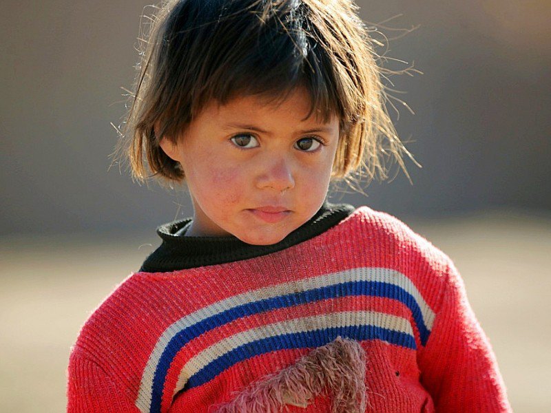 Un enfant iraquien déplacé des faubourgs de Tal Afar en Irak, dans un camp du village de Khalif Saleh le 12 décembre 2012 - AHMAD AL-RUBAYE [AFP]