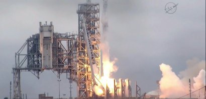 Photo capturée de la NASA TV du lancement de la capsule Dragon à bord de sa fusée Falcon 9, le 19 février 2017 du Centre spatial Kennedy en Floride - HO [NASA/AFP]
