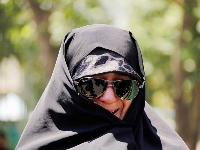 Une Iranienne aux funérailles des victimes des attentats à Téhéran, le 9 juin 2017 - ATTA KENARE [AFP]