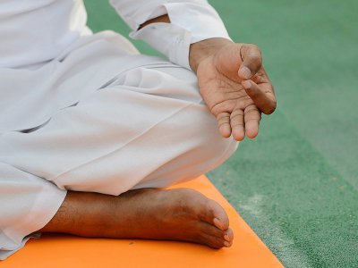 Décrétée par les Nations unies à l'initiative du Premier ministre indien Narendra Modi, la journée internationale du yoga tient sa troisième édition - Money SHARMA [AFP]