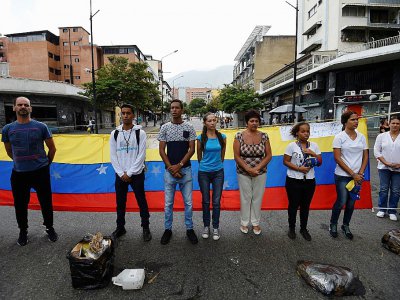Des militants de l'opposition vénézuélienne manifestent, le 10 juillet 2017 à Caracas - JUAN BARRETO [AFP]