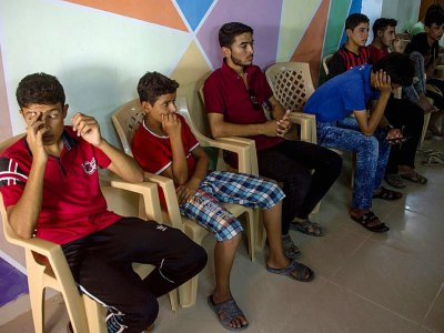 De jeunes irakiens, séparés de leurs familles, dans un centre de l'ONG Terre des Hommes Italia, dans le camp de déplacés de Debaga près de Mossoul, le 16 juillet 2017 - FADEL SENNA [AFP]