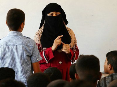 Une enseignante de l'école secondaire Trablous de Mossoul en Irak, le 27 juillet 2017 - SAFIN HAMED [AFP]