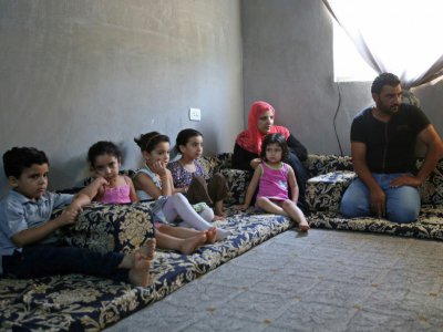 Des refugiés syriens logés dans un appartement à Irbid, en Jordanie, le 9 août 2017 - khalil mazraawi [afp/AFP]