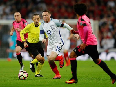 L'attaquant Wayne Rooney (c) lors de sa dernière sélection en équipe d'Angleterre face à l'Ecosse en qualif pour le Mondial-2018, le 11 novembre 2016 à Londres - Adrian DENNIS [AFP]