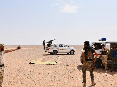 Des membres des forces gouvernementales à Bir Qabaqib, à plus de 40 km de Deir Ezzor, le 4 septembre 2017 - George OURFALIAN [AFP]