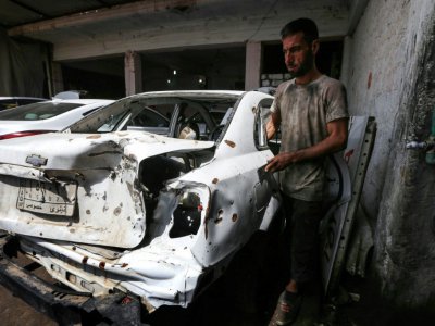 des voitures endommagées par les combats dans un garage de Mossoul-Est, le 6 septembre 2017 en Irak - SAFIN HAMED [AFP]