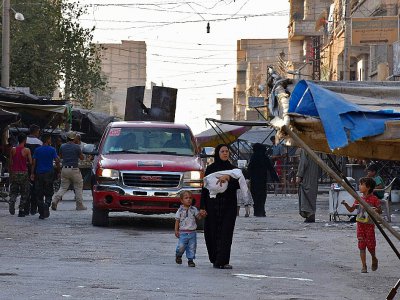 Dans une rue de Deir Ezzor, en Syrie, le 10 septembre 2017 - George OURFALIAN [AFP]