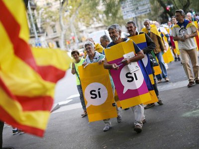 Des militants de l'association indépendantiste Assemblée nationale catalane (ANC) lors d'une "marche pour l'indépendance" à Barcelone le 27 septembre 2017 - PAU BARRENA [AFP/Archives]