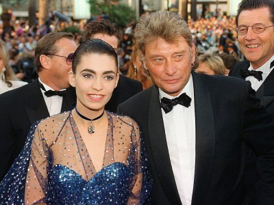 Johnny Hallyday et sa femme Adeline à Cannes, le 7 mai 1992 - MICHEL GANGNE [AFP/Archives]