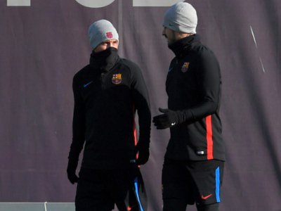 Lionel Messi et Luis Suarez durant une séance d'entraînement le 22 décembre 2017 près de Barcelone - LLUIS GENE [AFP]