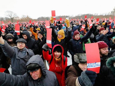 Des partisans de Navalny manifestent à Moscou le 24 décembre, à la veille de la décision de la Commission électorale - Olga MALTSEVA [AFP]