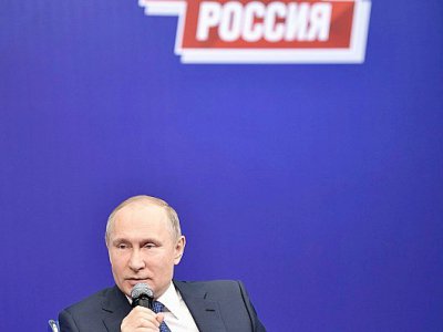 Le président russe Vladimir Poutine s'exprime le 30 janvier 2018 à Moscou à son QG de campagne pour la présidentielle de mars prochain - Alexey NIKOLSKY [Sputnik/AFP]