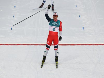 La Norvégienne Marit Björgen franchit à la 2e place l'épreuve de skiathlon aux JO (ski de fond 7,5 km classique), le 10 février 2018 à Pyeongchang - Christof STACHE [AFP]