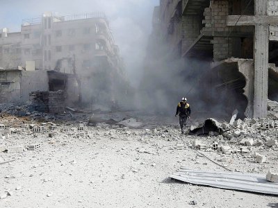 Bombardements du régime syrien sur la ville de Saqba, le 23 février 2018 dans la Ghouta orientale - ABDULMONAM EASSA [AFP]