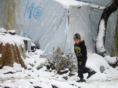 Un enfant syrien dans un camp de réfugiés dans la ville syrienne de Quneitra, le 26 janvier 2018 - Mohamad ABAZEED [AFP/Archives]
