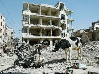 Bâtiment éventré à Douma, principale ville de la Ghouta orientale, près de Damas, le 12 mars 2018 - HASAN MOHAMED [AFP]