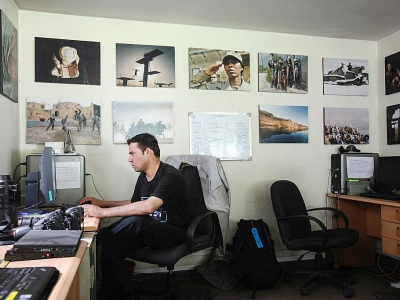 AFP's Shah Marai sits at his desk in the Kabul bureau in this 2010 photo - Ed Jones [AFP]