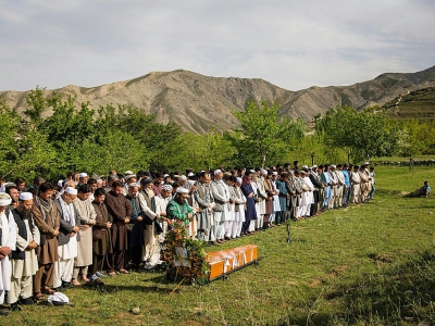 Mourners pray before the Monday burial of AFP Afghanistan chief photographer Shah Marai in Kabul on Monday - Andrew Quilty [POOL/AFP]