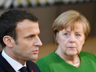 Emmanuel Macron et Angela Merkel le 23 février 2018 à Bruxelles - ARIS OIKONOMOU [AFP/Archives]
