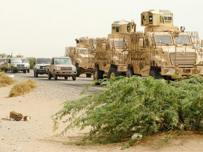 Une colonne de véhicules blindés et de pick-up transportant des forces progouvernementales yéménites arrive dans la localité d'al-Douraïhimi, à quelque neuf km du port de la ville de Hodeida, tenue par les rebelles et cible d'une offensive, le 13 jui - NABIL HASSAN [AFP]