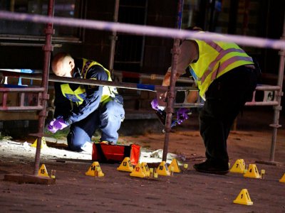 Des policiers sur les lieux de la fusillade à Malmö, en Suède, le 18 juin 2018 - Johan NILSSON [TT News Agency/AFP]