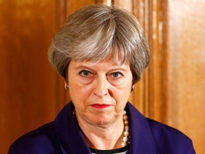 La Première ministre britannique Theresa May doit faire le grand écart entre les europhobes de son parti et les partisans du maintien de liens étroits avec l'UE - HENRY NICHOLLS [POOL/AFP]