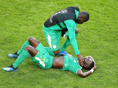 Le Sénégalais Idrissa Gana Gueye éffondré après la défaite face à la Colombie et l'élimination du Mondial, le 28 juin 2018 à Samara - Fabrice COFFRINI [AFP]