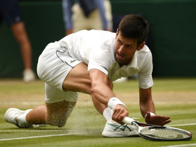 Novak Djokovic contre Rafael Nadal en demi-finale de Wimbledon, le 14 juillet 2018 - Oli SCARFF [AFP]