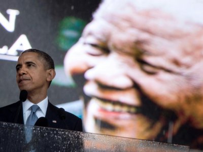 Le président américain Barack Obama lors d'un hommage funèbre à Nelson Mandela, le 10 décembre 2013 à Johannesburg - BRENDAN SMIALOWSKI [AFP/Archives]