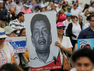 Des partisans du président Ortega défilent dans les rues de Managua le 23 juillet 2018 à l'appel de l'Union nationale des étudiants nicaraguayens (UNEN) - INTI OCON [AFP]