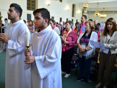 "A Lourdes, on peut mettre toutes nos souffrances ensemble, dans les mains de la Vierge", confie Bachar, un pélerin, à Lourdes, le 14 août 2018 - PASCAL PAVANI [AFP]